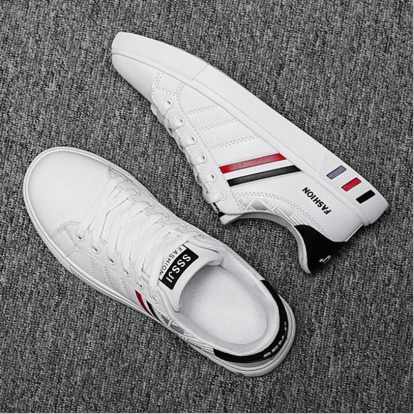 Stevvex pair white casual sneakers with red/black side stripes, lace-up, vulcanized flat sole on Tampa Home & Garden Store
