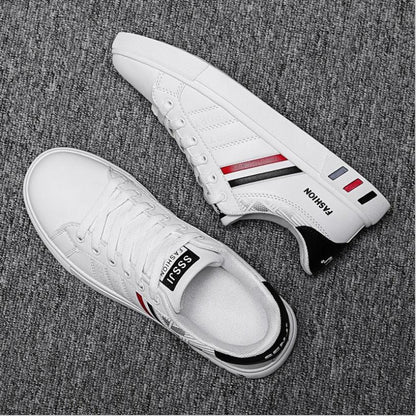 Stevvex pair white casual sneakers with red/black side stripes, lace-up, vulcanized flat sole on Tampa Home & Garden Store