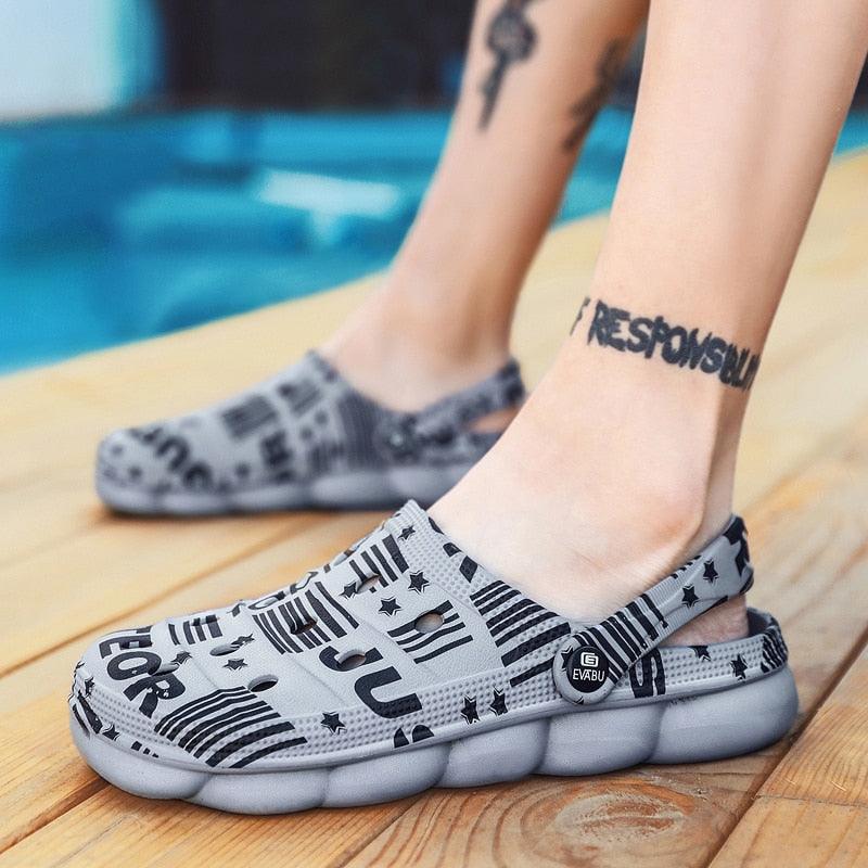 Men's gray camo Stevvex slip-on sandals with EVABU logo strap and contoured chunky sole on Tampa Home & Garden Store
