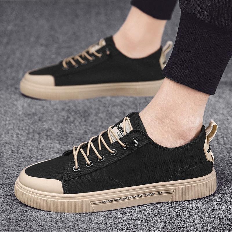 Stevvex men's black canvas sneakers with beige sole and toe cap, lace-up casual design on Tampa Home & Garden Store