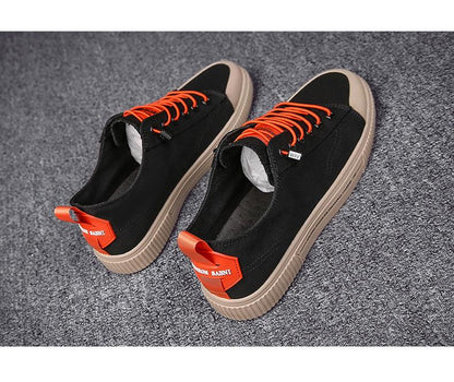 Stevvex sneakers black canvas orange laces beige sole red heel tab pair on Tampa Home & Garden Store
