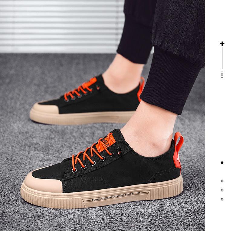 Stevvex men's canvas sneakers black upper, orange laces, beige sole pair on Tampa Home & Garden Store