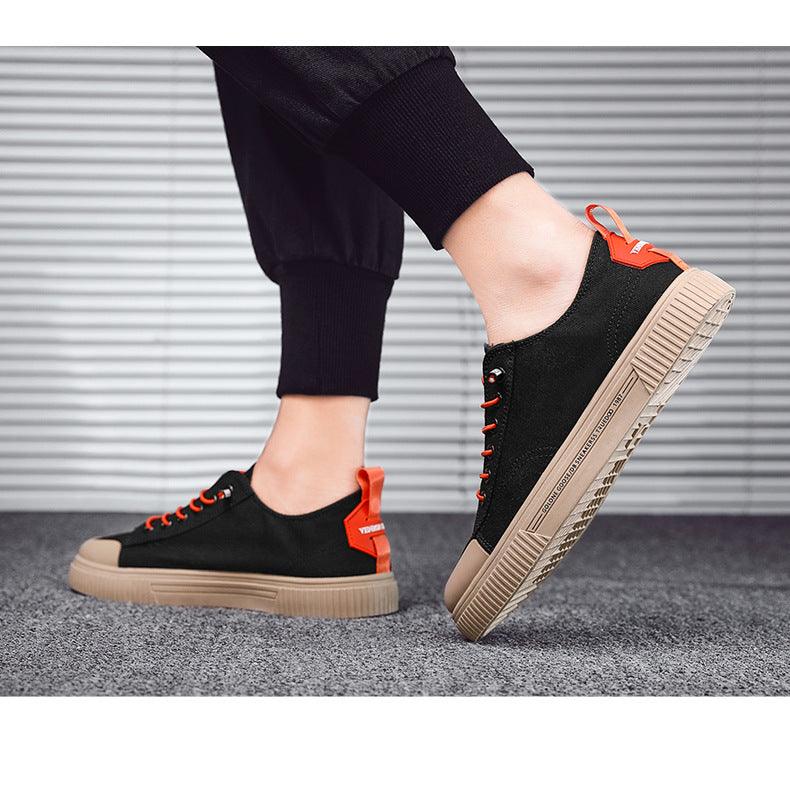 Stevvex men's black canvas sneakers with orange laces and beige sole pair on Tampa Home & Garden Store