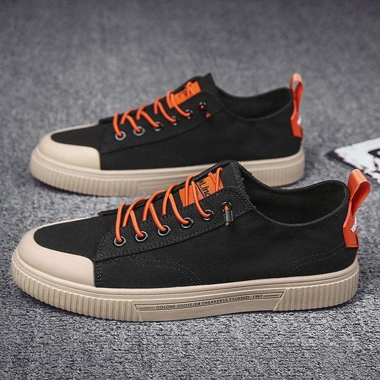 Stevvex ST85SH5037EGW black canvas sneakers pair with orange laces and beige sole on Tampa Home & Garden Store