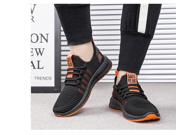 Stevvex men's black mesh sneakers with orange sole, breathable lightweight casual trainers on Tampa Home & Garden Store