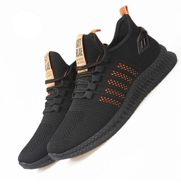 Stevvex men's breathable mesh sneakers black with orange sole lightweight casual trainers pair on Tampa Home & Garden Store