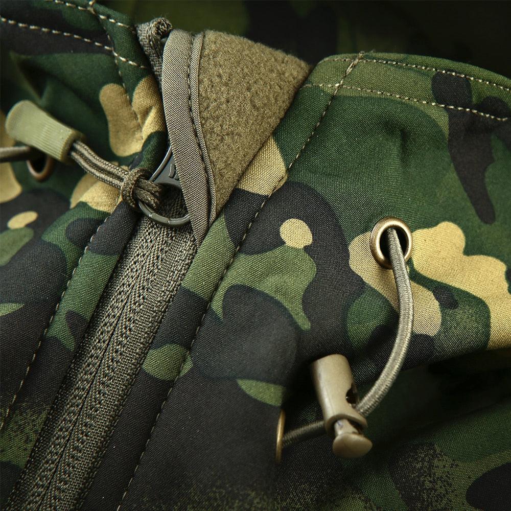 Stevvex men's green camouflage windbreaker close-up of drawcord, metal grommets, and zipper on Tampa Home & Garden Store