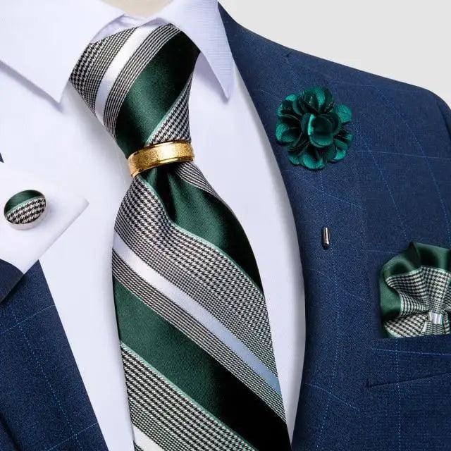 Men's green striped silk necktie with gold pin worn with navy suit and green boutonniere on Tampa Home & Garden Store
