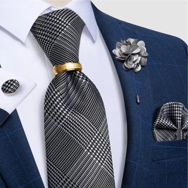 Stevvex necktie set with black-and-white plaid silk tie and cufflinks on blue suit on Tampa Home & Garden Store