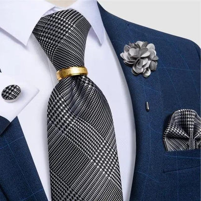 Stevvex necktie set with black-and-white plaid silk tie and cufflinks on blue suit on Tampa Home & Garden Store