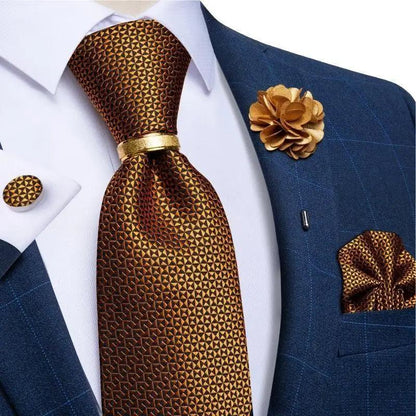 Men's copper brown geometric silk necktie with gold accents and matching pocket square on navy suit on Tampa Home & Garden Store