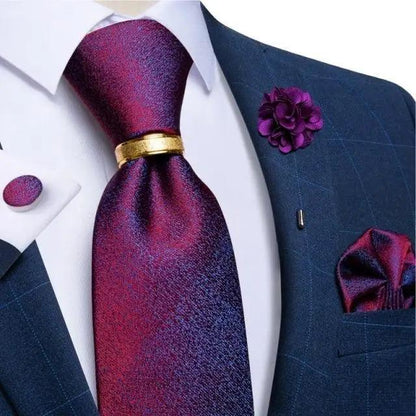 Men's red silk necktie with gold tie bar on navy suit with purple boutonniere on Tampa Home & Garden Store