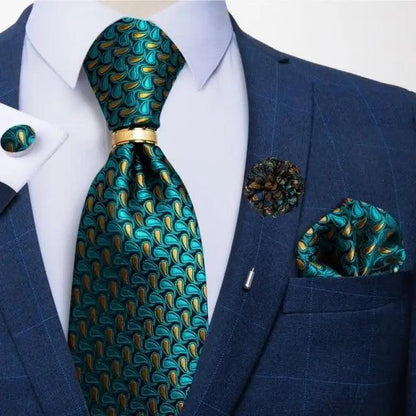 Teal patterned silk necktie with gold motif worn with a navy suit and a pocket square on Tampa Home & Garden Store