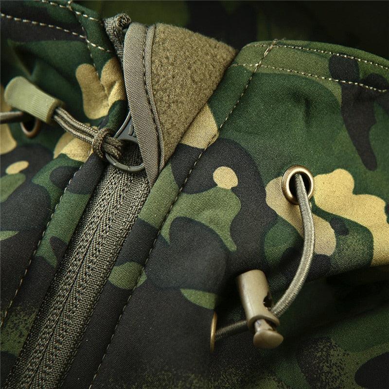 Stevvex camouflage tactical jacket with green camo pattern, hooded windbreaker, drawstring on Tampa Home & Garden Store