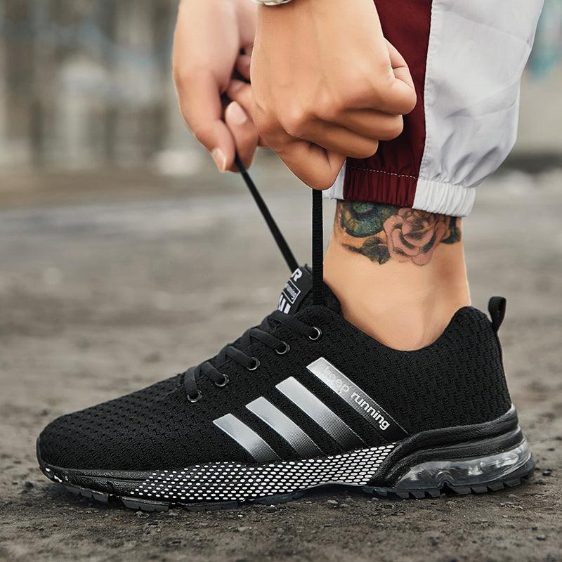 Stevvex men's breathable mesh running sneakers, black with silver stripes and air-cushion sole on Tampa Home & Garden Store