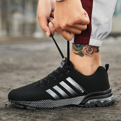 Stevvex men's breathable mesh running sneakers, black with silver stripes and air-cushion sole on Tampa Home & Garden Store