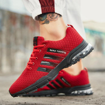 Red breathable mesh sneakers with black side stripes and air cushion sole for running on Tampa Home & Garden Store
