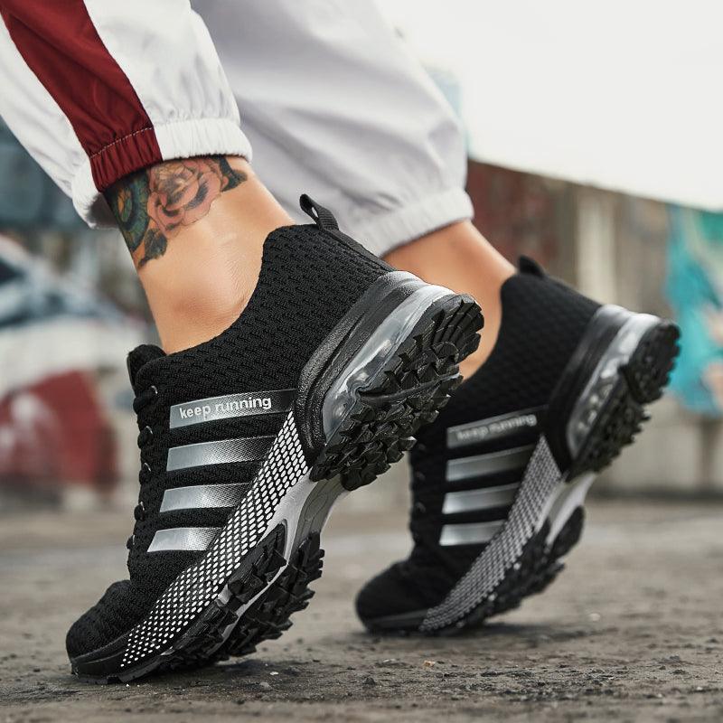 Pair of men's breathable mesh running sneakers with air cushion sole in black on Tampa Home & Garden Store