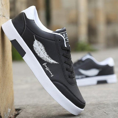 Stevvex men's black sneakers with white sole and feather graphic on side, two sneakers shown on Tampa Home & Garden Store