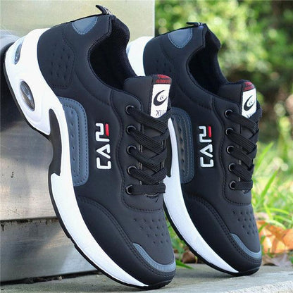 Men's leather casual sneakers Stevvex, black upper with blue-grey accents and white sole pair on Tampa Home & Garden Store