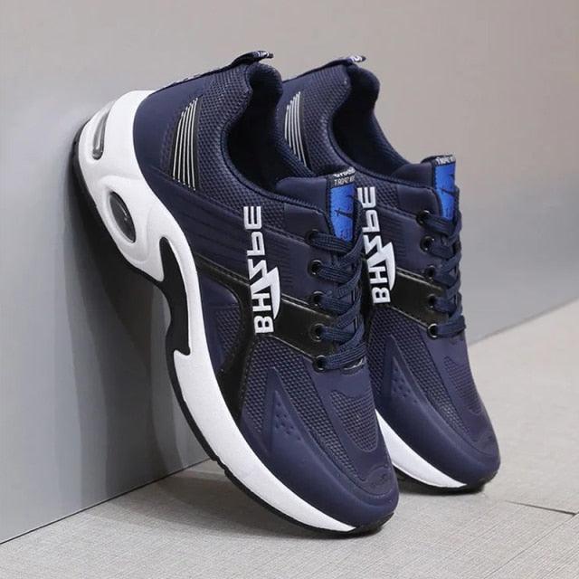 Pair of men's navy blue leather sneakers by Stevvex with breathable mesh and white sole on Tampa Home & Garden Store