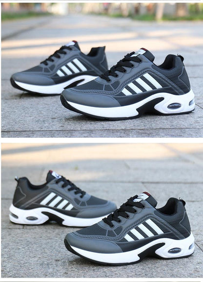 Pair of grey leather sneakers with black overlays and white stripe accents, chunky white sole on Tampa Home & Garden Store