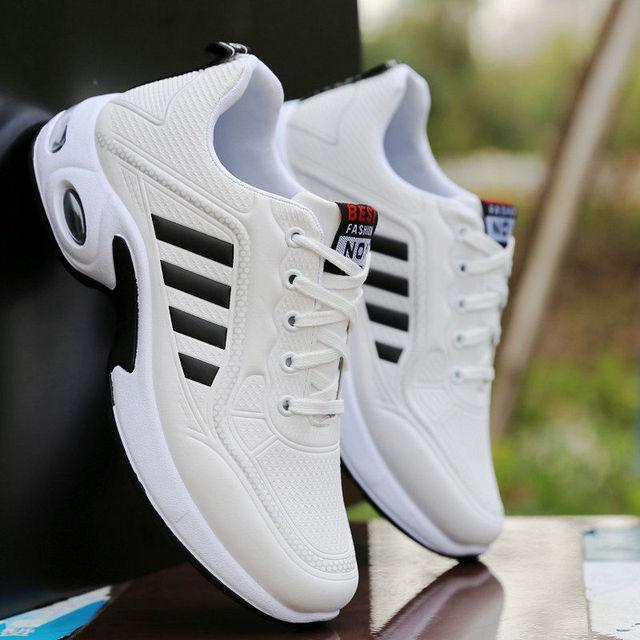 Men's white leather sneakers with black side stripes, casual sporty running style on Tampa Home & Garden Store