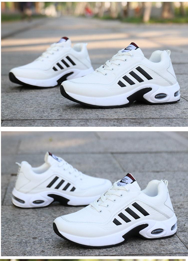 Pair of Stevvex men's white leather sneakers with black side stripes and a chunky sole on Tampa Home & Garden Store
