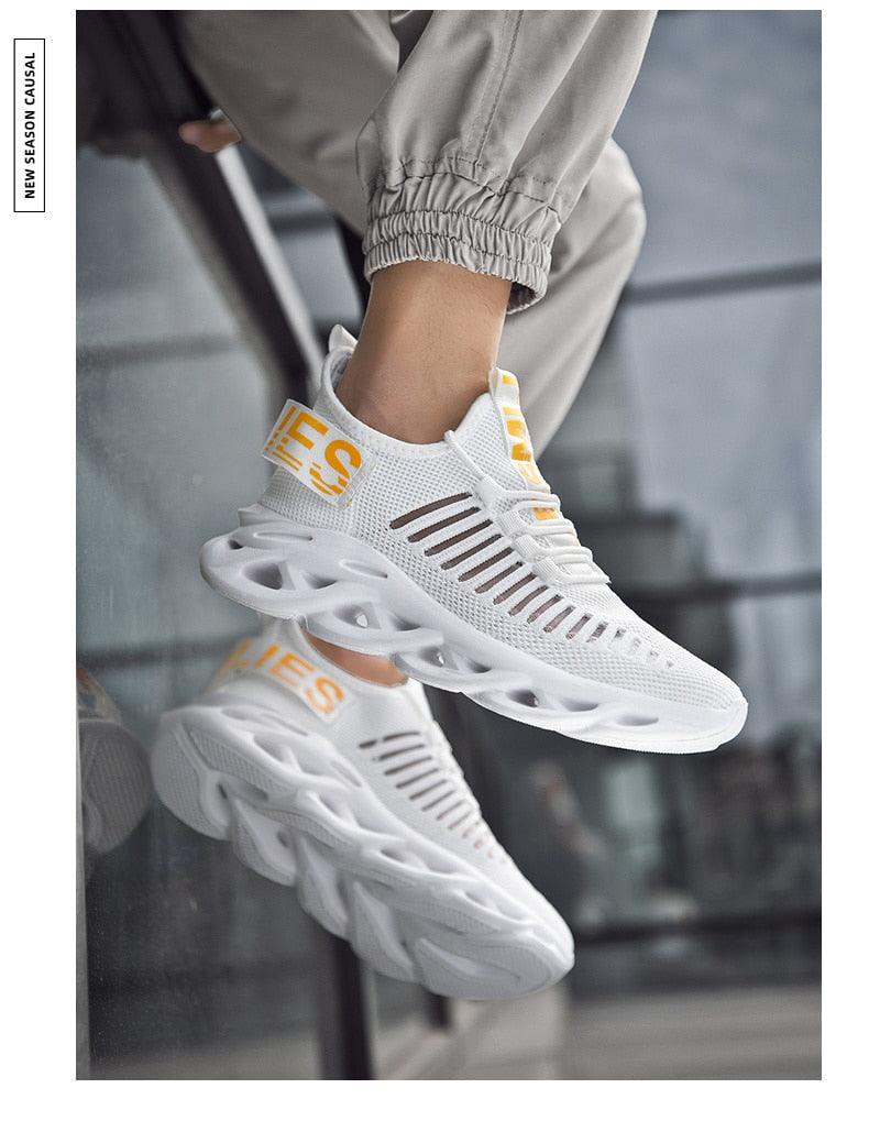 Stevvex men's white breathable knit sneakers with yellow pull tabs and sculpted hollow sole on Tampa Home & Garden Store