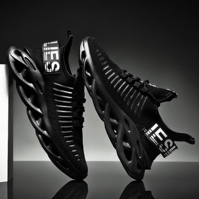 Men's Stevvex sneakers, black breathable-knit upper with sculpted hollow rubber sole, pair on Tampa Home & Garden Store