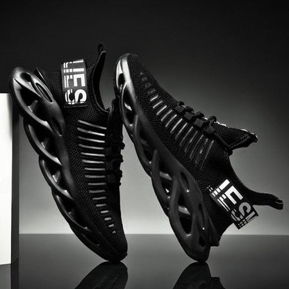 Men's Stevvex sneakers, black breathable-knit upper with sculpted hollow rubber sole, pair on Tampa Home & Garden Store