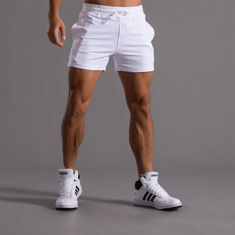 Men's Stevvex white shorts with drawstring, quick-dry fabric; white Adidas sneakers on Tampa Home & Garden Store
