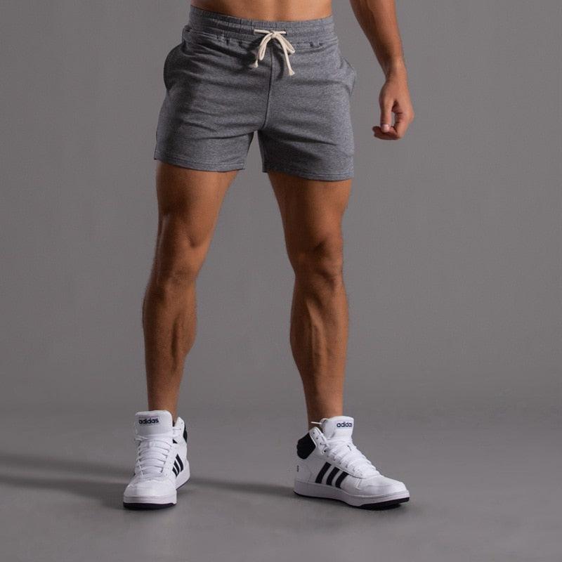Men's gray athletic shorts for running and gym, quick-dry breathable fabric, Adidas sneakers on Tampa Home & Garden Store