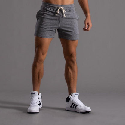Men's gray athletic shorts for running and gym, quick-dry breathable fabric, Adidas sneakers on Tampa Home & Garden Store