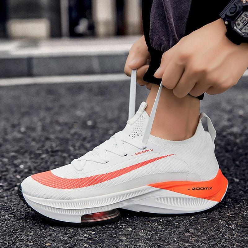 Men's training sneakers white with orange accents, breathable mesh upper, air cushion sole on Tampa Home & Garden Store