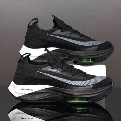 Stevvex men's athletic sneakers pair black mesh upper with gray stripe and green air unit on Tampa Home & Garden Store