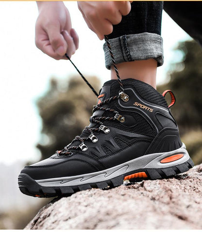 High-top hiking boot black leather with gray sole, orange trim, breathable rugged outsole on Tampa Home & Garden Store