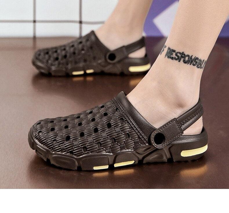 Men's black slip-on garden sandals with perforated upper and back strap, yellow accents on sole on Tampa Home & Garden Store