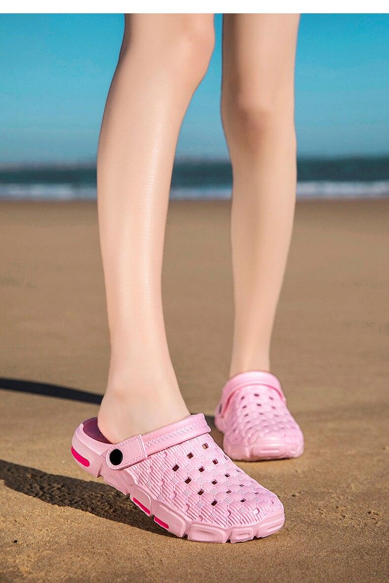 Pink perforated slip-on garden sandals for men, lightweight rubber water shoes on sand on Tampa Home & Garden Store