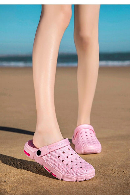 Pink perforated slip-on garden sandals for men, lightweight rubber water shoes on sand on Tampa Home & Garden Store