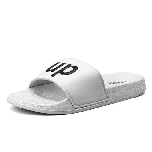 Men's white Stevvex slide sandal with black strap logo, non-slip quick-dry bathroom slipper on Tampa Home & Garden Store