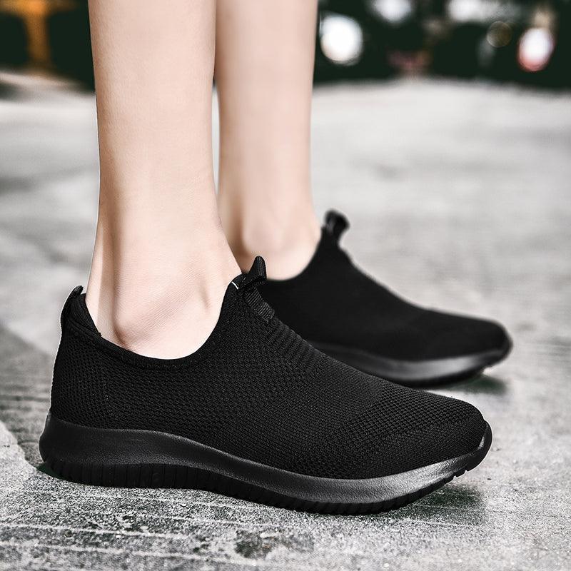 Men's black slip-on mesh sneakers with breathable knit upper and cushioned sole pair on Tampa Home & Garden Store