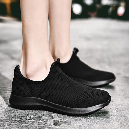 Men's black slip-on mesh sneakers with breathable knit upper and cushioned sole pair on Tampa Home & Garden Store