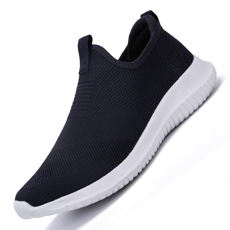 Men's navy knit-mesh slip-on sneakers with white flexible sole on Tampa Home & Garden Store