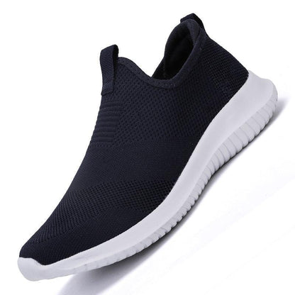 Men's navy knit-mesh slip-on sneakers with white flexible sole on Tampa Home & Garden Store