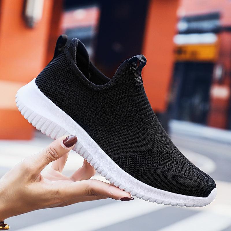 Stevvex men's slip-on mesh sneakers, black breathable knit upper with white sole on Tampa Home & Garden Store