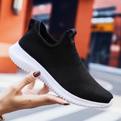 Stevvex men's slip-on mesh sneakers, black breathable knit upper with white sole on Tampa Home & Garden Store