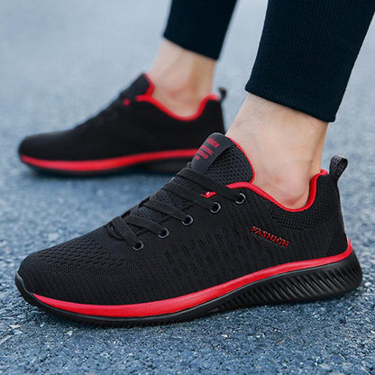 Stevvex men's running sneakers pair with black knit upper and red accents on Tampa Home & Garden Store