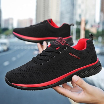Stevvex men's sport lightweight running sneakers, black breathable knit pair with red trim on Tampa Home & Garden Store