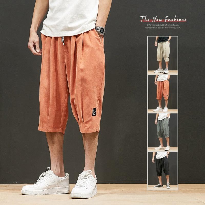 Stevvex men’s loose casual jogger shorts in orange with drawstring and pockets on Tampa Home & Garden Store